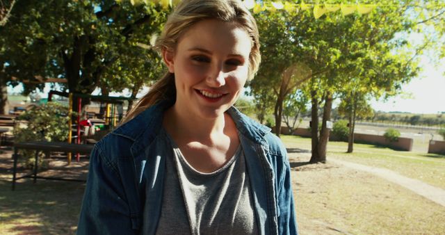 Smiling Woman Enjoying Sunny Day at Park - Download Free Stock Images Pikwizard.com