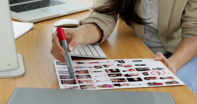 Woman Reviewing Model Portfolio at Desk - Download Free Stock Images Pikwizard.com