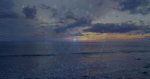 Glowing sunset reflecting on ocean with futuristic hud rings and digital overlay