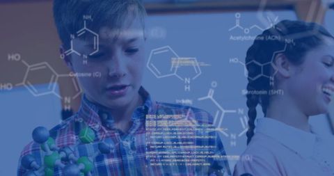 Children exploring chemistry concepts with 3d molecular models