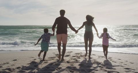 Family Enjoys Quality Time on Seaside Walk - Download Free Stock Images Pikwizard.com