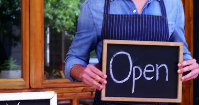 Small Business Owner Holding Open Sign Outside Shop - Download Free Stock Images Pikwizard.com