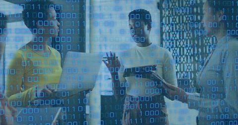Collaborating team analyzing cybersecurity data with laptop and tablet binary overlay