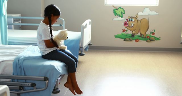 Lonely Child Holding Teddy Bear in Pediatric Hospital Room - Download Free Stock Images Pikwizard.com