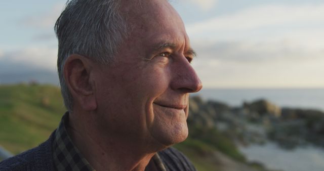 Content elderly man enjoying serene coastal view - Download Free Stock Images Pikwizard.com