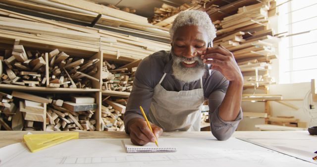 Smiling Carpenter Working on Project in Wood Workshop - Download Free Stock Images Pikwizard.com