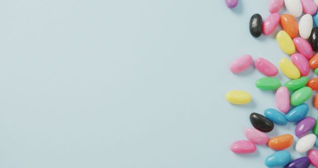 Assorted Colorful Jelly Beans on Light Blue Background - Download Free Stock Images Pikwizard.com