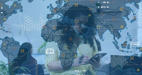 Curly-haired professional tapping tablet, analyzing global data overlay for collaboration