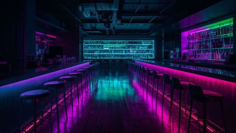 Neon bar interior glowing in magenta and cyan, central aisle leading to backlit liquor shelves