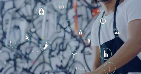 Innovative bike mechanic working with interactive technology in repair shop