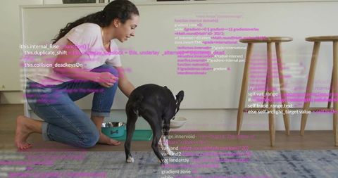 Woman kneeling feeding black dog in cozy modern kitchen with purple code overlay