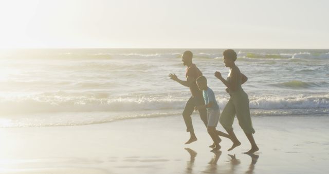 Family Running on Beach at Sunset - Download Free Stock Images Pikwizard.com