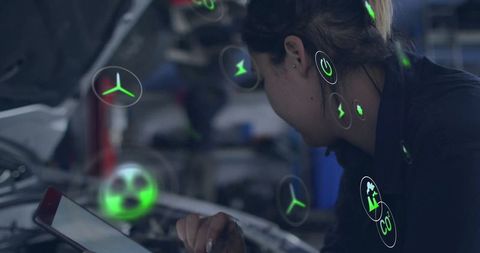 Technician Utilizing Augmented Reality Technology in Garage Workshop