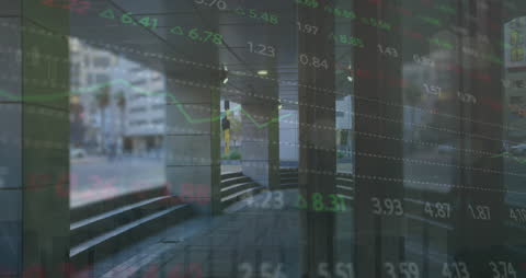 Stock Market Trading Data Overlying Busy Cityscape