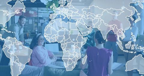 Global collaboration team brainstorming in modern coworking lounge with world map overlay