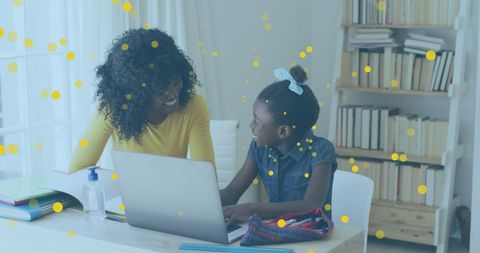 Mother Assists Daughter With Online Learning Assignment at Home - Download Free Stock Images Pikwizard.com