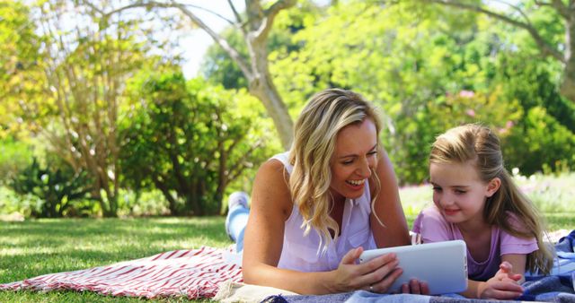 Mother and Daughter Enjoying Outdoor Time Together With Tablet - Download Free Stock Images Pikwizard.com