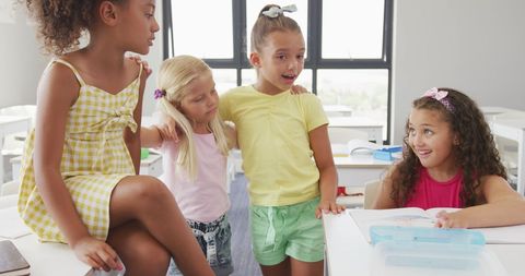 Diverse Group of Happy Schoolgirls Socializing in Classroom - Download Free Stock Images Pikwizard.com