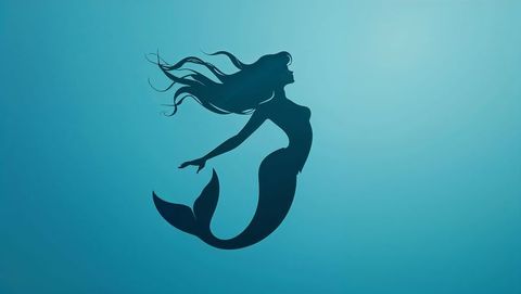 Silhouette of enchanting mermaid in serene underwater scene