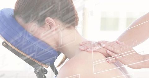 Sunlit therapeutic shoulder massage on portable face-cradle chair with spa hud overlay