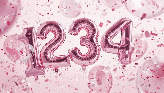 Rose gold number balloons 1 2 3 4 floating among confetti and transparent balloons on pink backdrop