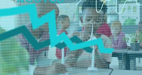Students building wind turbine model while analyzing turquoise data overlay in stem classroom