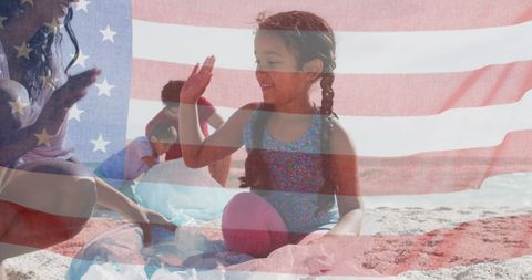American Flag Overlay Young Family on Beach Celebrating Freedom