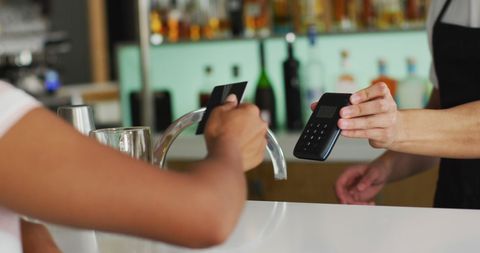 Paying for Drinks with Credit Card at Bar Counter - Download Free Stock Images Pikwizard.com