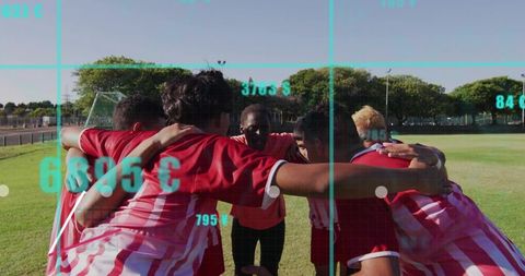 Energetic soccer players huddling for team strategy