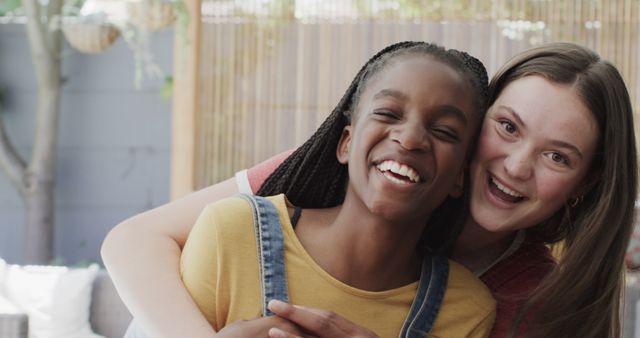 Two Happy Teen Friends Embracing and Laughing Outdoors - Download Free Stock Images Pikwizard.com