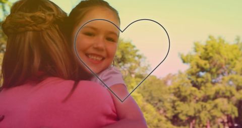 Loving Mother and Daughter Embracing in Sunny Park
