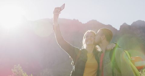 Caucasian Couple Taking Selfies on Mountain Hike