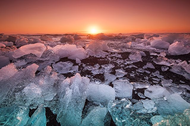 Sunset Over Iceberg Beach with Vibrant Sky - Download Free Stock Photos Pikwizard.com