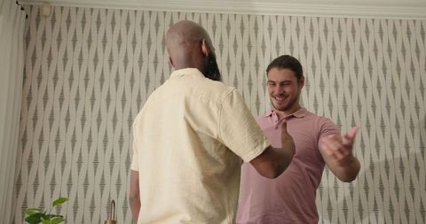 Friends Embracing and Laughing in Modern Room Interior