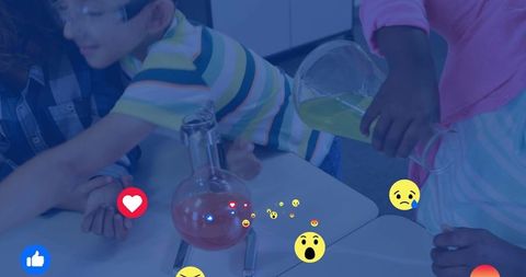 Students pouring green solution during hands-on classroom chemistry experiment