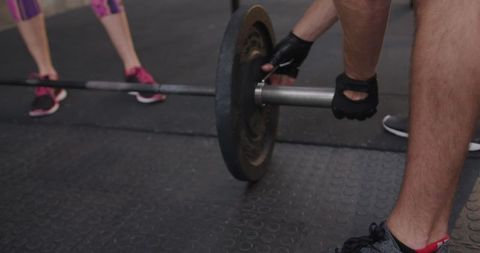 Workout Preparation: Adjusting Barbell Weights for Exercise