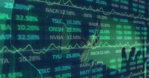 Businessman Analyzing Financial Data Displays in Office Setting