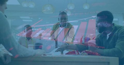 Designers collaborating in fashion studio amid digital project analytics