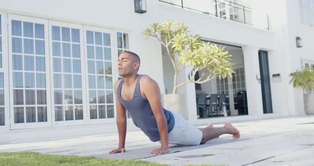 Man Practicing Yoga Outdoors Upscale Home Background - Download Free Stock Images Pikwizard.com