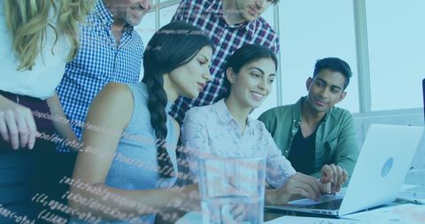 Team Collaborating at Computer with Data Overlay