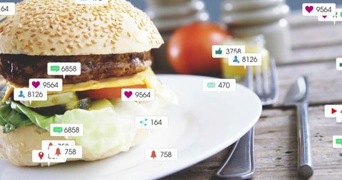 Viral cheeseburger closeup on rustic wooden table with floating social media notifications