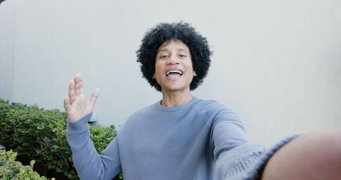 Casual Vlog: Man Communicating Outdoors with Smile and Gesture