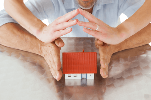 hands forming protective roof above miniature house transparent concept - Download Free Stock Videos Pikwizard.com