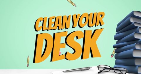 Motivational clean your desk concept with books and office supplies on green background