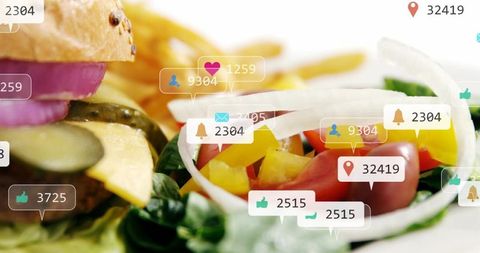 Gourmet cheeseburger and fresh salad showing social media engagement icons and counters