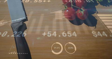 Kitchen knife and cherry tomatoes with augmented reality data overlays on wooden board
