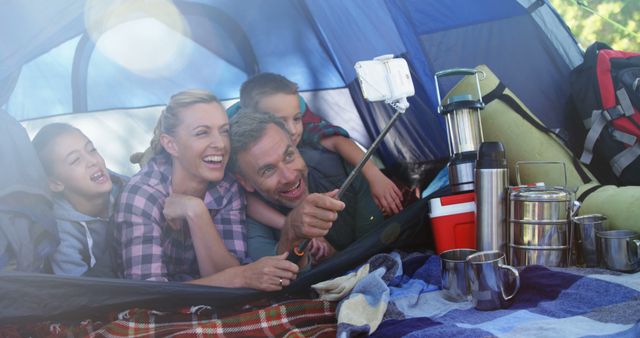 Family Relaxes While Taking a Selfie in Camping Tent - Download Free Stock Images Pikwizard.com