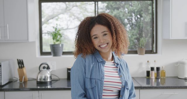 Woman Smiling in Modern Kitchen, Radiant and Happy - Download Free Stock Images Pikwizard.com