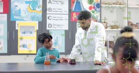 Teacher Guiding Student in Chemistry Experiment in Classroom - Download Free Stock Images Pikwizard.com