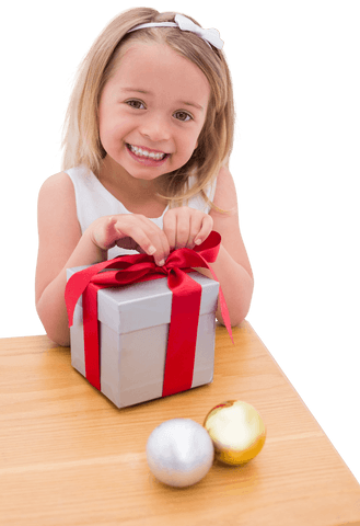 joyful child with holiday gift and ornaments on wooden table - Download Free Stock Videos Pikwizard.com